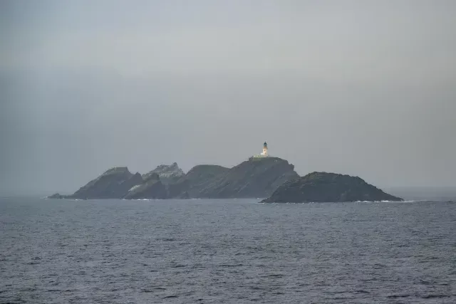 The Muckle Flugga lighthouse with the gannet colony